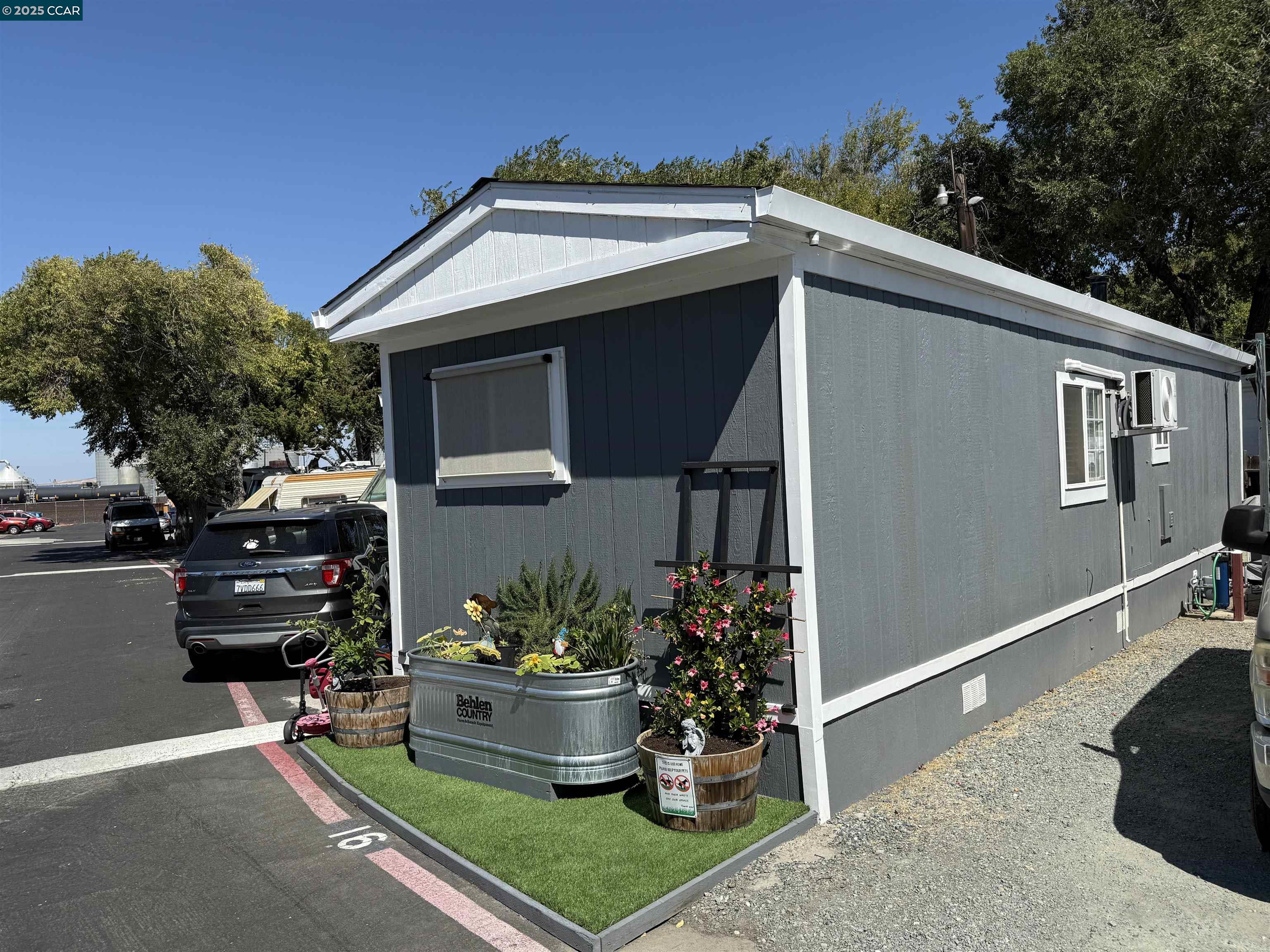 1526 Willow Pass Road, Unit 16 Pittsburg, CA 94565 - Photo 2 of 10 a front view of house with yard