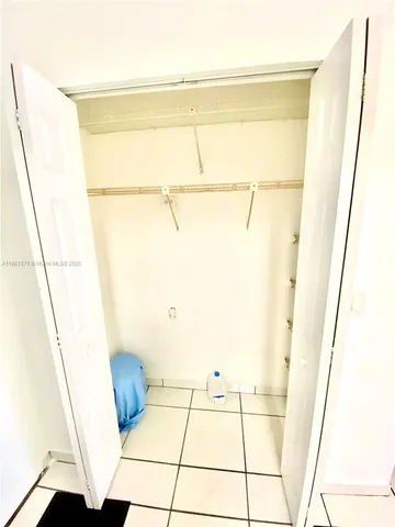 a bathroom with a shower and a sink