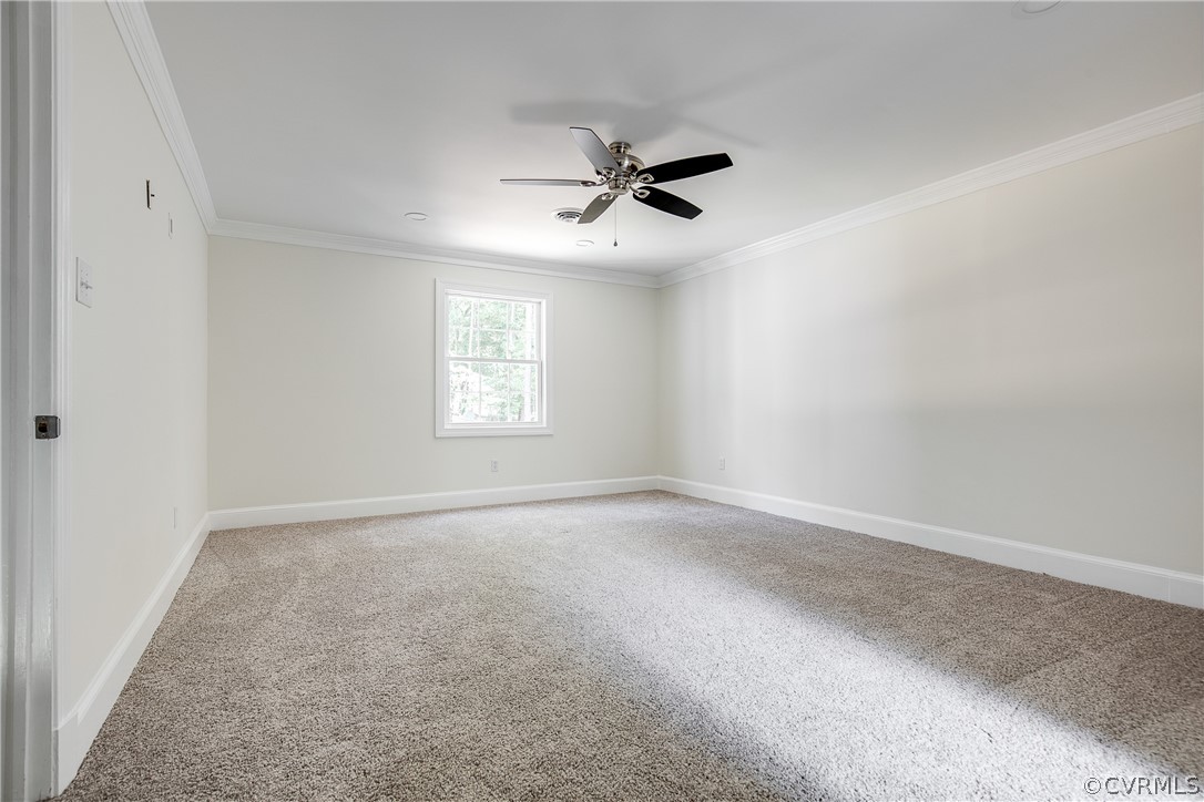 9340 Cardiff Loop Road North Chesterfield, VA 23236 - Photo 32 of 36 an empty room with windows and fan