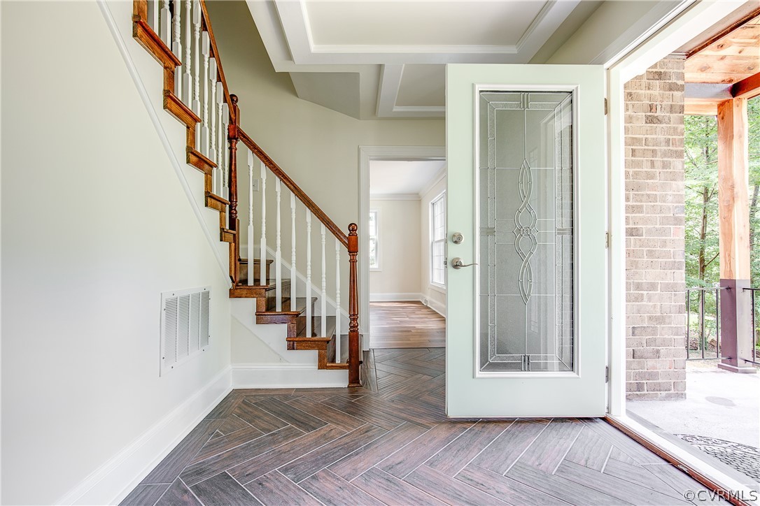 9340 Cardiff Loop Road North Chesterfield, VA 23236 - Photo 5 of 36 a view of an entryway with wooden floor and stairs