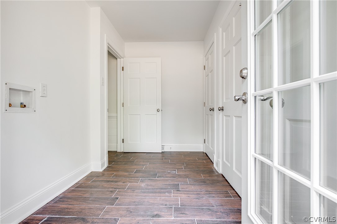9340 Cardiff Loop Road North Chesterfield, VA 23236 - Photo 8 of 36 a view of a hallway with wooden floor and staircase