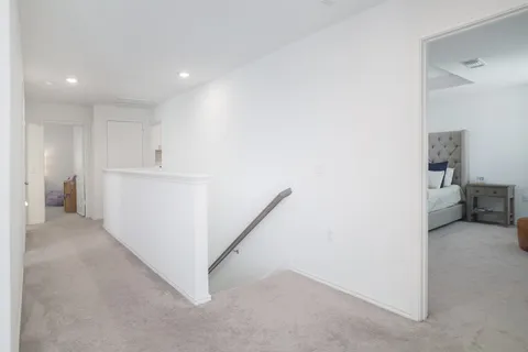 a bathroom with a granite countertop sink a toilet and a mirror
