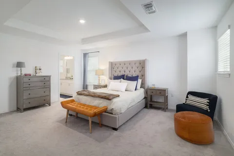 a bedroom with a bed and a cabinets