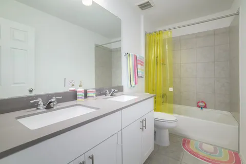 a big house with a big yard and large trees