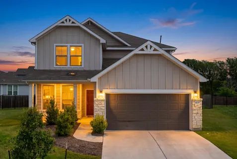 an aerial view of a house with a garden