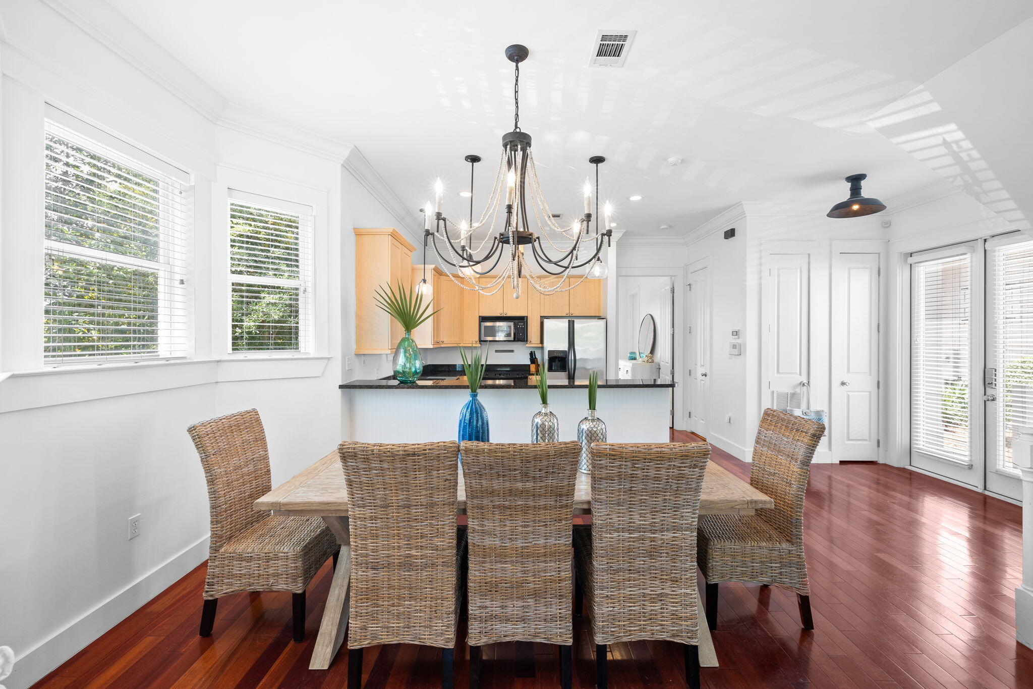 67 West Blue Crab Loop Inlet Beach, FL 32461 - Photo 15 of 78 a view of a dining room with furniture wooden floor and chandelier