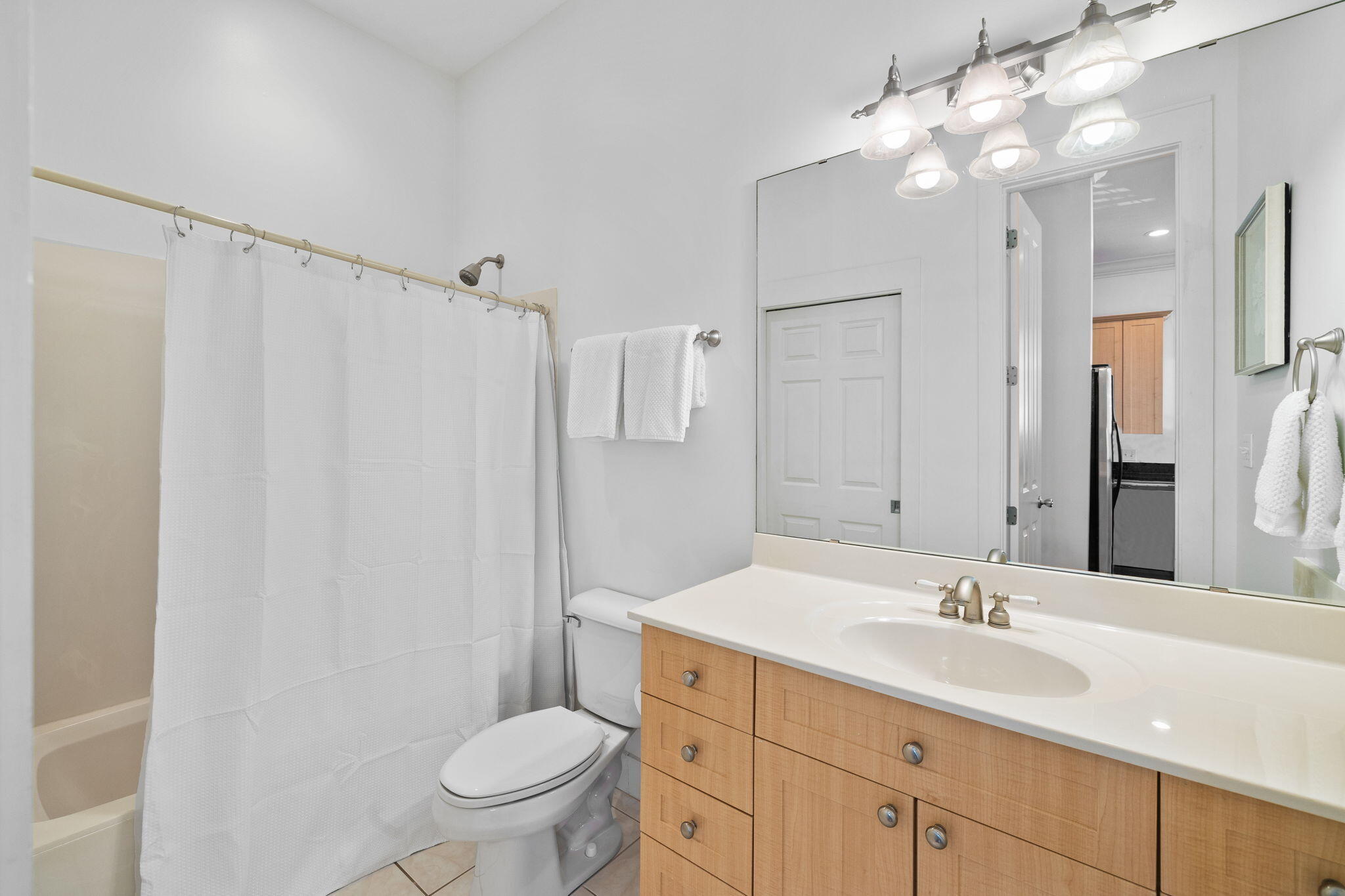 67 West Blue Crab Loop Inlet Beach, FL 32461 - Photo 33 of 78 a bathroom with a sink a toilet a mirror a vanity and shower