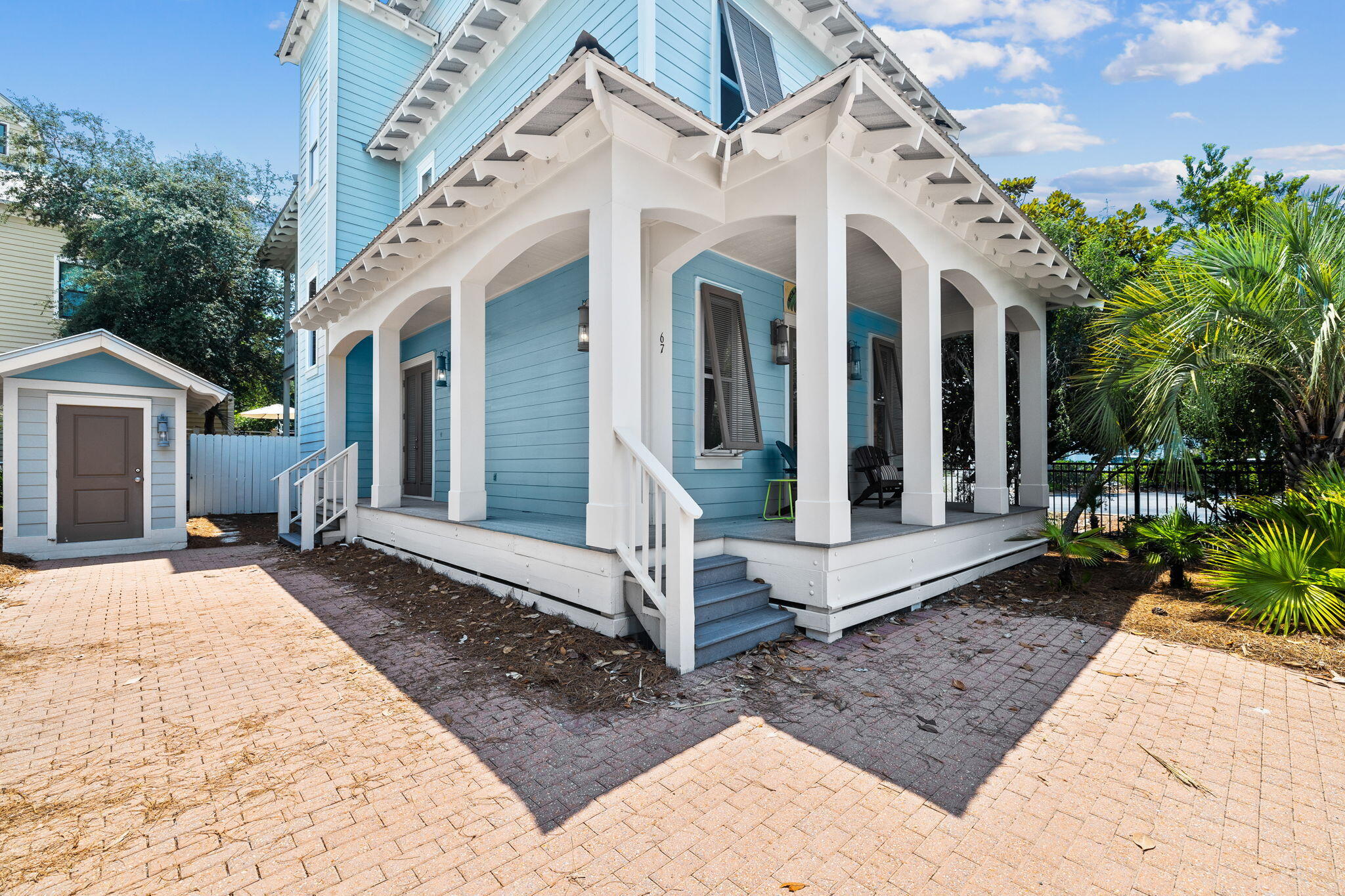 67 West Blue Crab Loop Inlet Beach, FL 32461 - Photo 55 of 78 a view of a white house with a yard and table and chairs