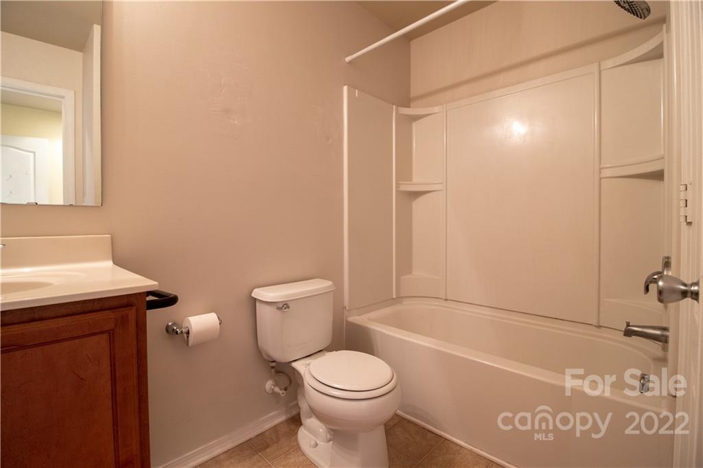 662 Potter Place Road Fort Mill, SC 29708 - Photo 19 of 28 a bathroom with a sink a toilet and shower