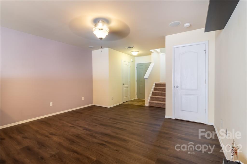662 Potter Place Road Fort Mill, SC 29708 - Photo 7 of 28 an empty room with wooden floor and window