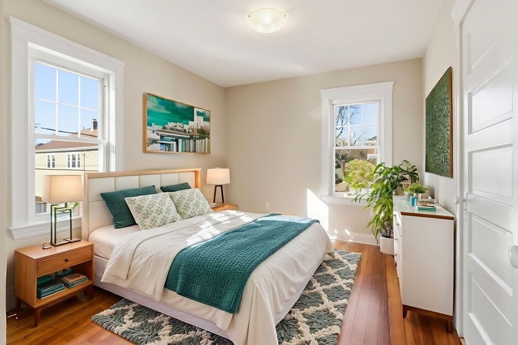 113 Minot Street, Unit 2 Boston, MA 02122 - Photo 11 of 34 a bedroom with a bed and a potted plant