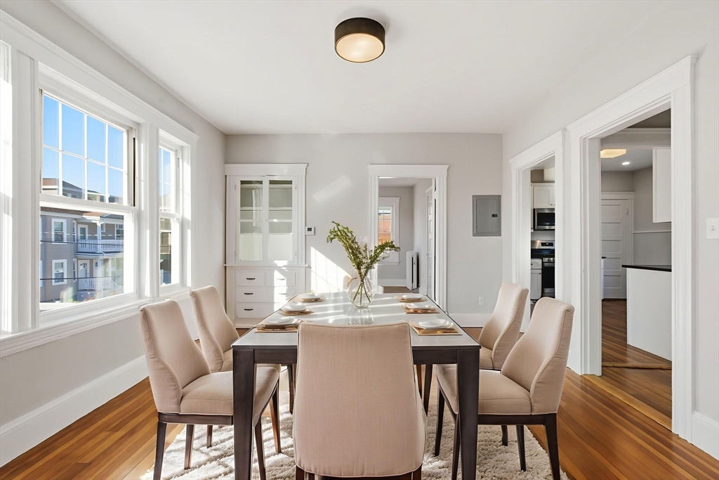 113 Minot Street, Unit 2 Boston, MA 02122 - Photo 15 of 34 a view of a dining room with furniture window and wooden floor