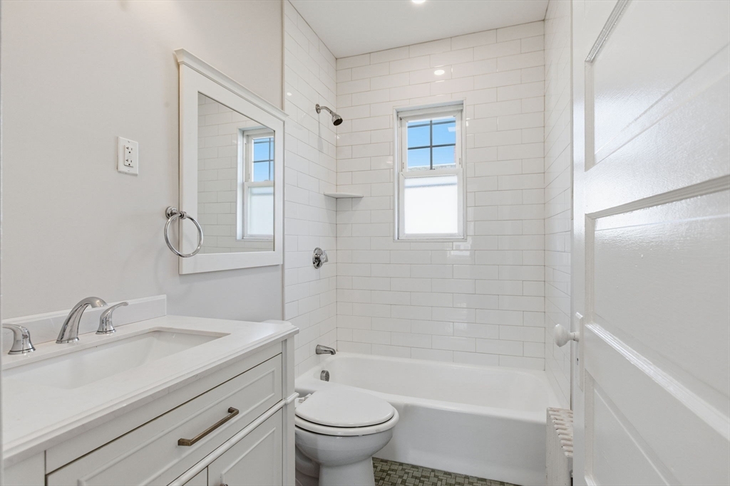 113 Minot Street, Unit 2 Boston, MA 02122 - Photo 19 of 34 a bathroom with a sink toilet and shower