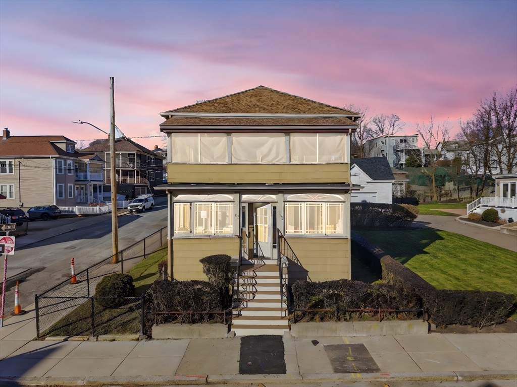 113 Minot Street, Unit 2 Boston, MA 02122 - Photo 33 of 34 a front view of a house with a yard