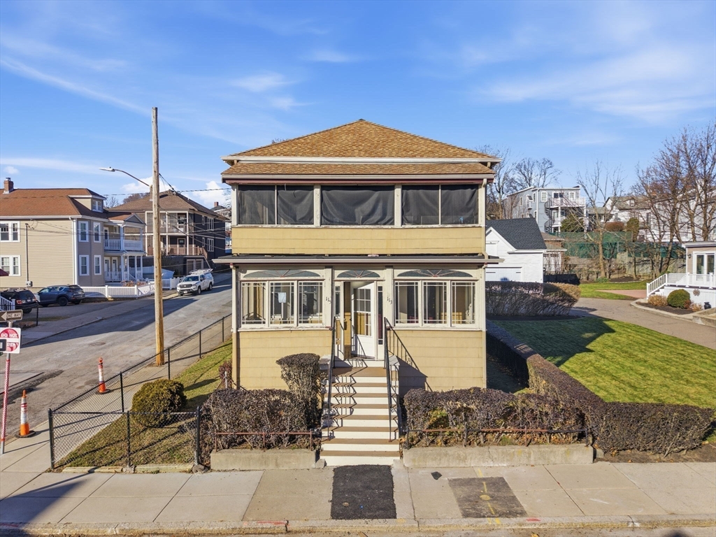113 Minot Street, Unit 2 Boston, MA 02122 - Photo 34 of 34 a front view of a house with a yard