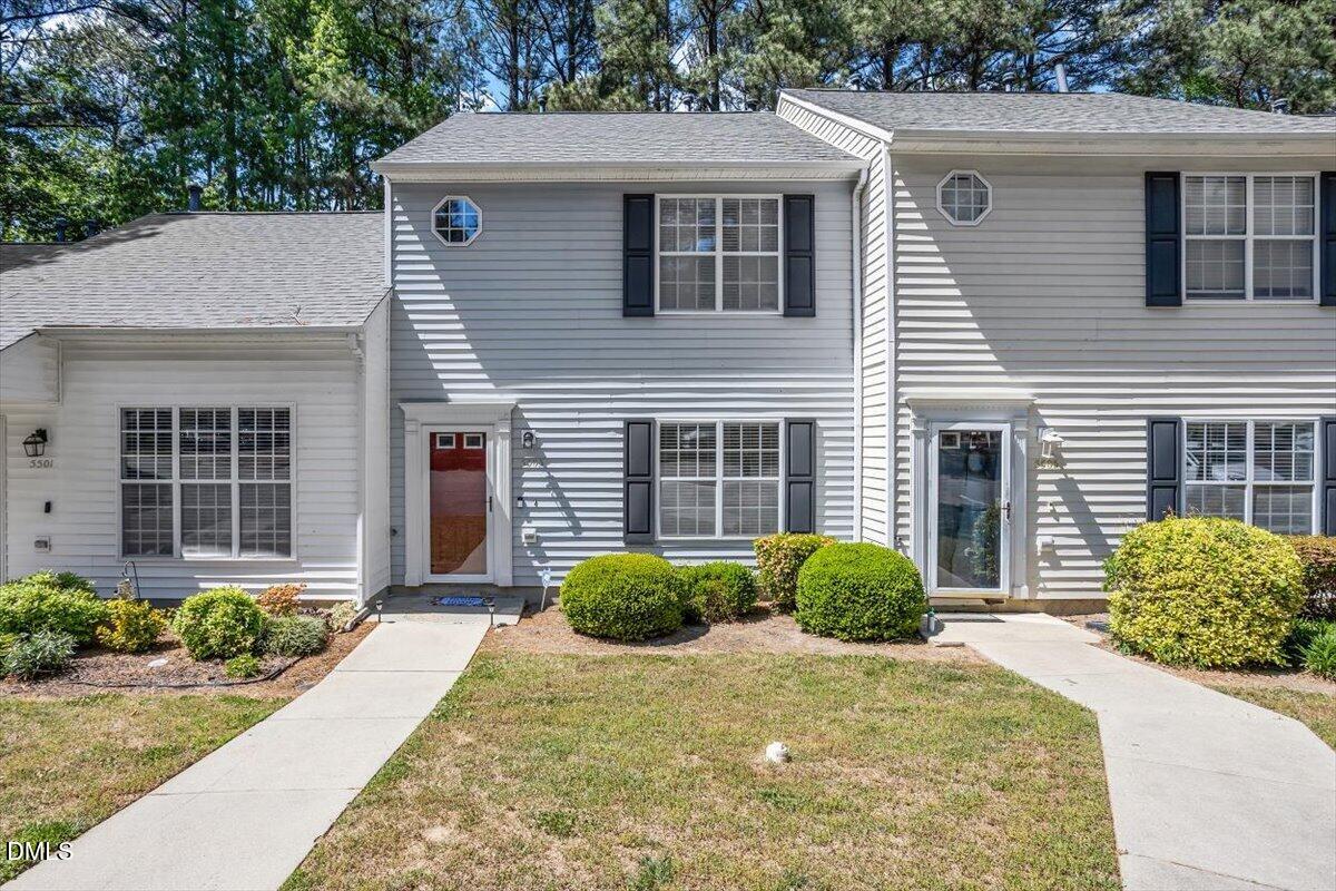 5503 Fieldcross Court Raleigh, NC 27610 - Photo 1 of 26 a view of a house with brick walls and a yard
