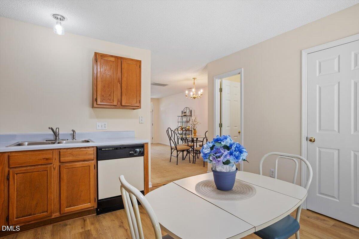 5503 Fieldcross Court Raleigh, NC 27610 - Photo 16 of 26 a kitchen with a table and chair