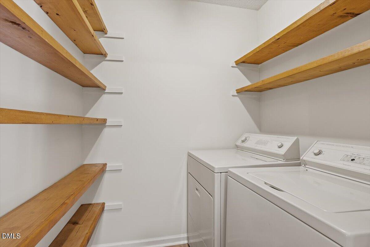 5503 Fieldcross Court Raleigh, NC 27610 - Photo 17 of 26 a utility room with dryer and washer
