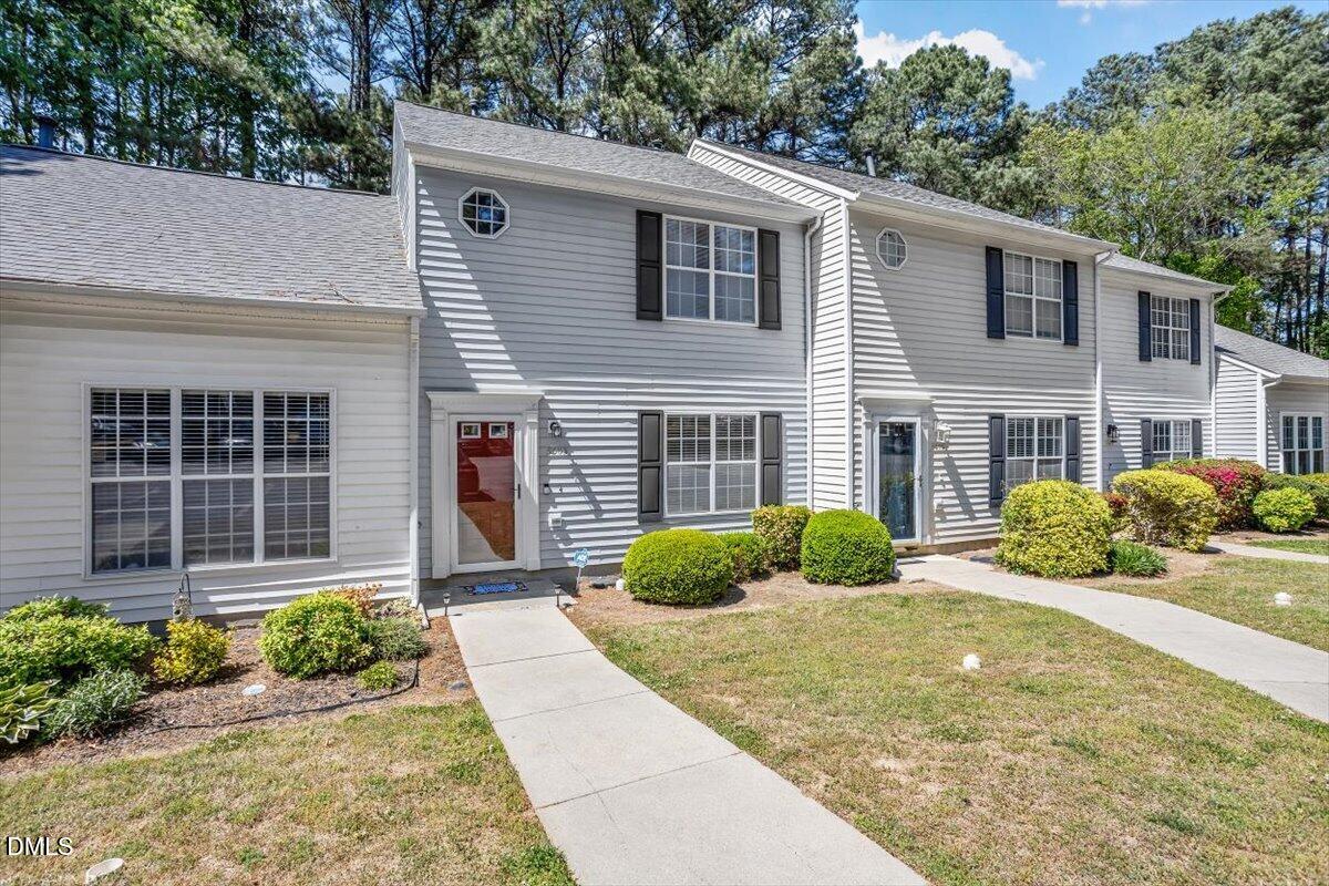 5503 Fieldcross Court Raleigh, NC 27610 - Photo 2 of 26 a front view of a house with garden