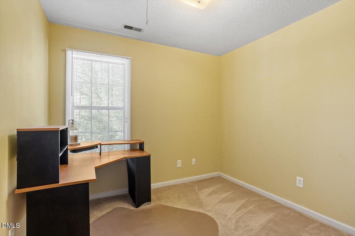 5503 Fieldcross Court Raleigh, NC 27610 - Photo 23 of 26 an empty room with a window