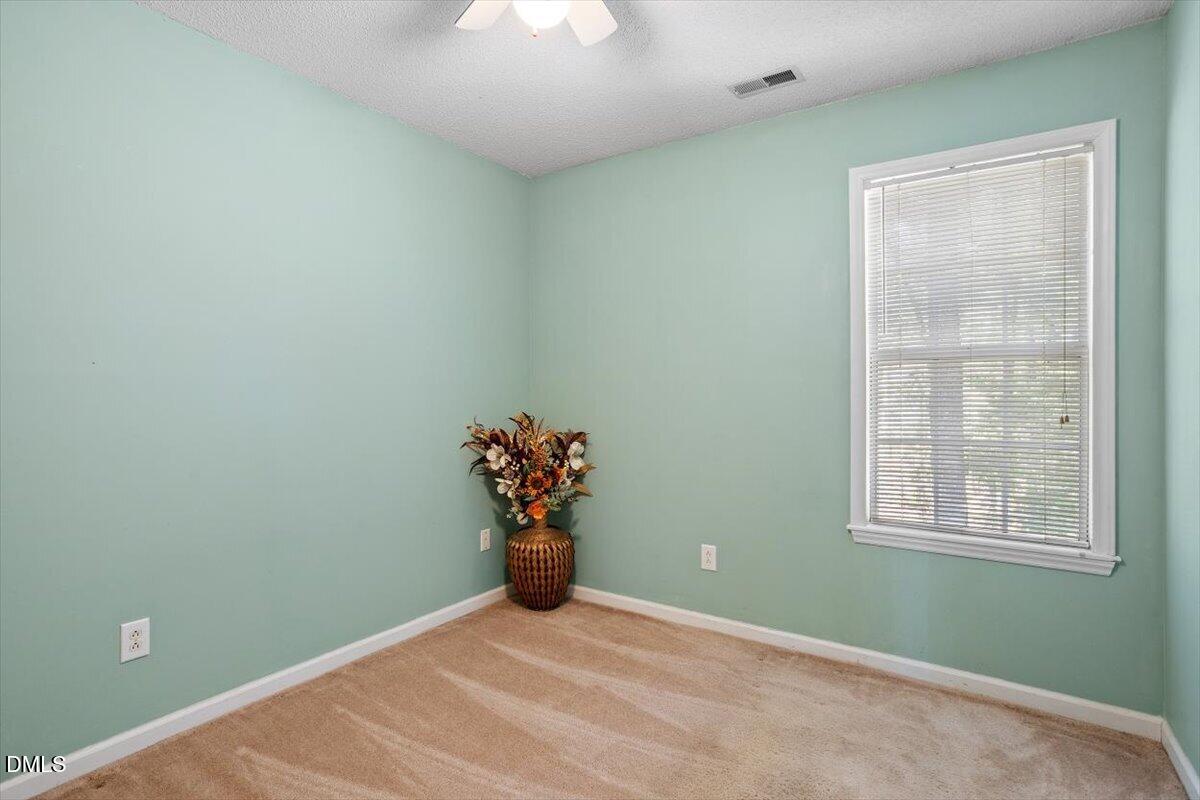 5503 Fieldcross Court Raleigh, NC 27610 - Photo 24 of 26 a view of an empty room with a window