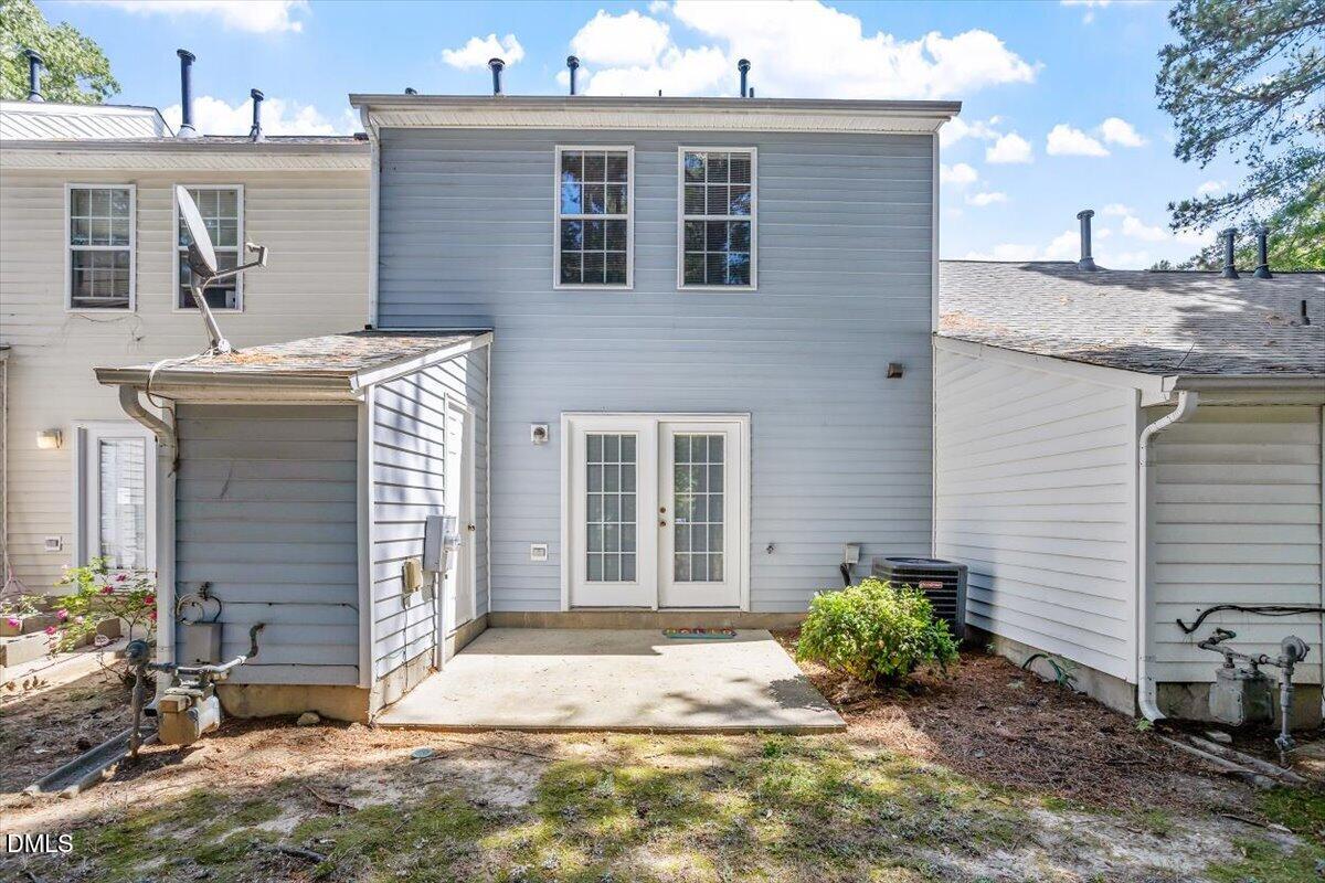 5503 Fieldcross Court Raleigh, NC 27610 - Photo 25 of 26 a front view of a house with garden