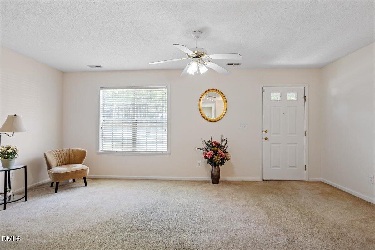 5503 Fieldcross Court Raleigh, NC 27610 - Photo 5 of 26 an empty room with a window