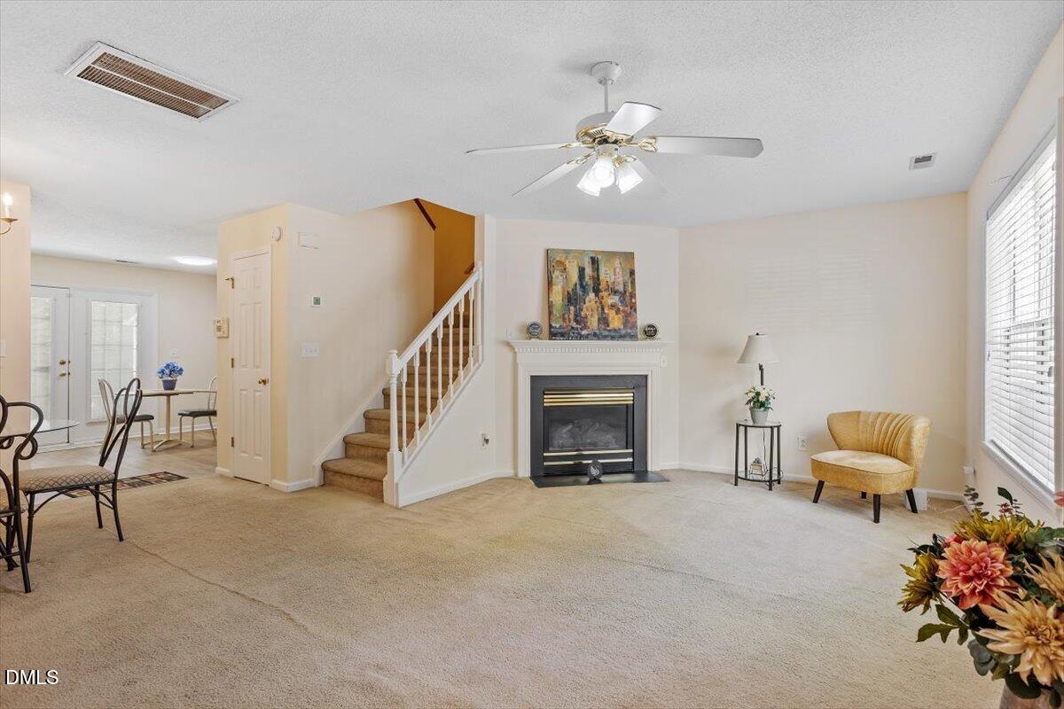 5503 Fieldcross Court Raleigh, NC 27610 - Photo 9 of 26 a view of livingroom with furniture and staircase
