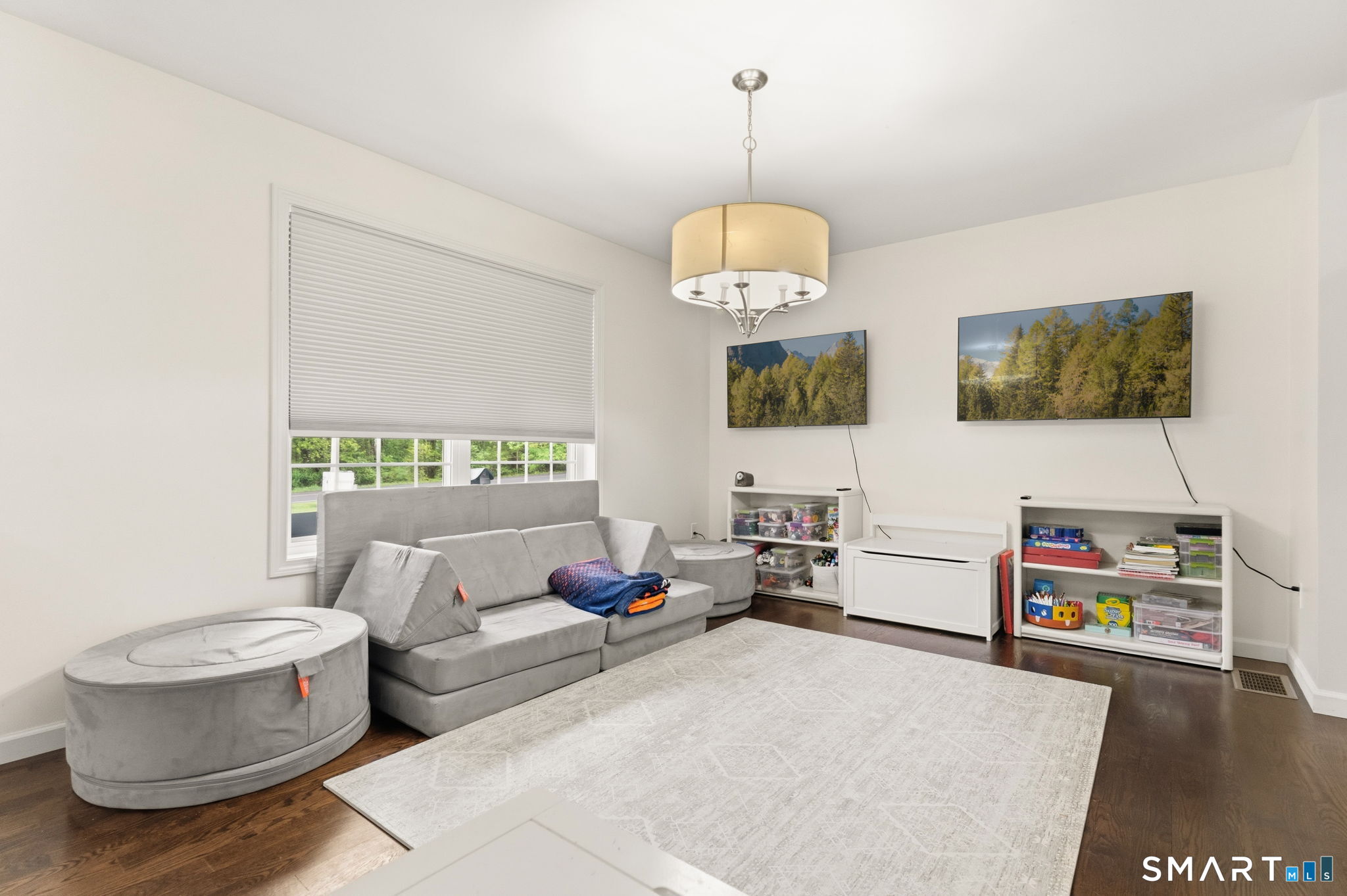 160 Canal Road Suffield, CT 06078 - Photo 12 of 40 a living room with furniture and a chandelier