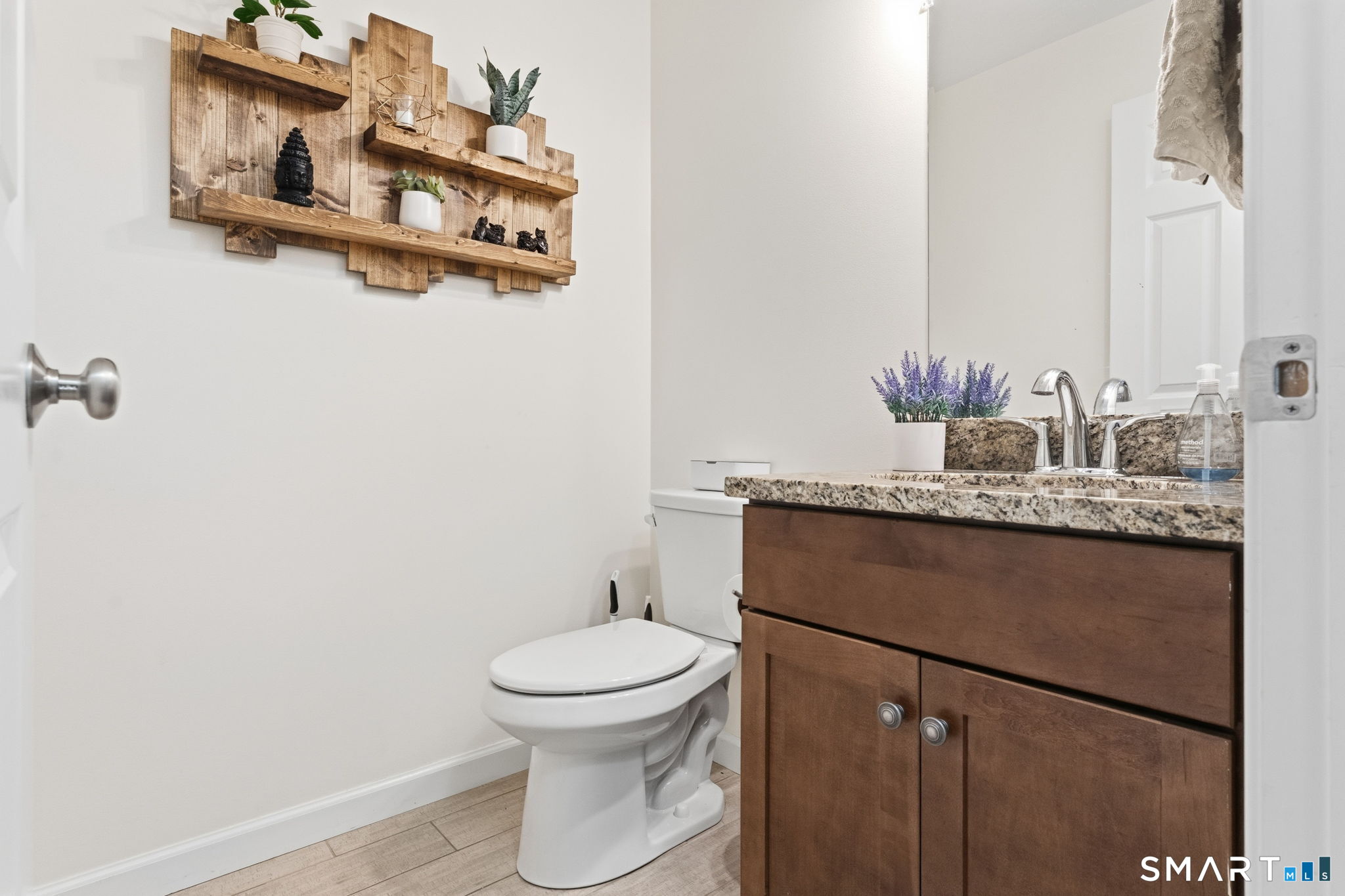 160 Canal Road Suffield, CT 06078 - Photo 17 of 40 a bathroom with a granite countertop sink and a toilet