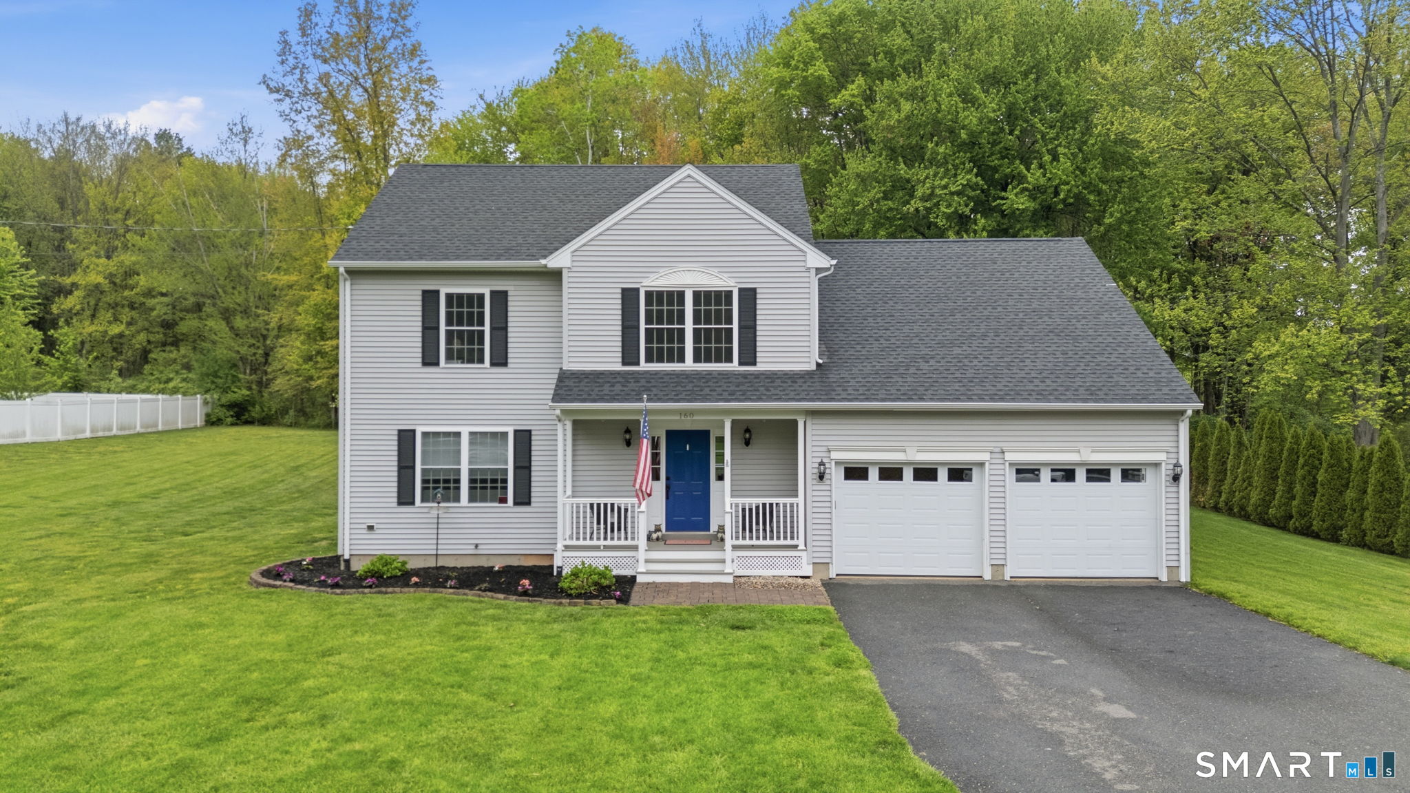 160 Canal Road Suffield, CT 06078 - Photo 2 of 40 a front view of a house with a yard garage and outdoor seating