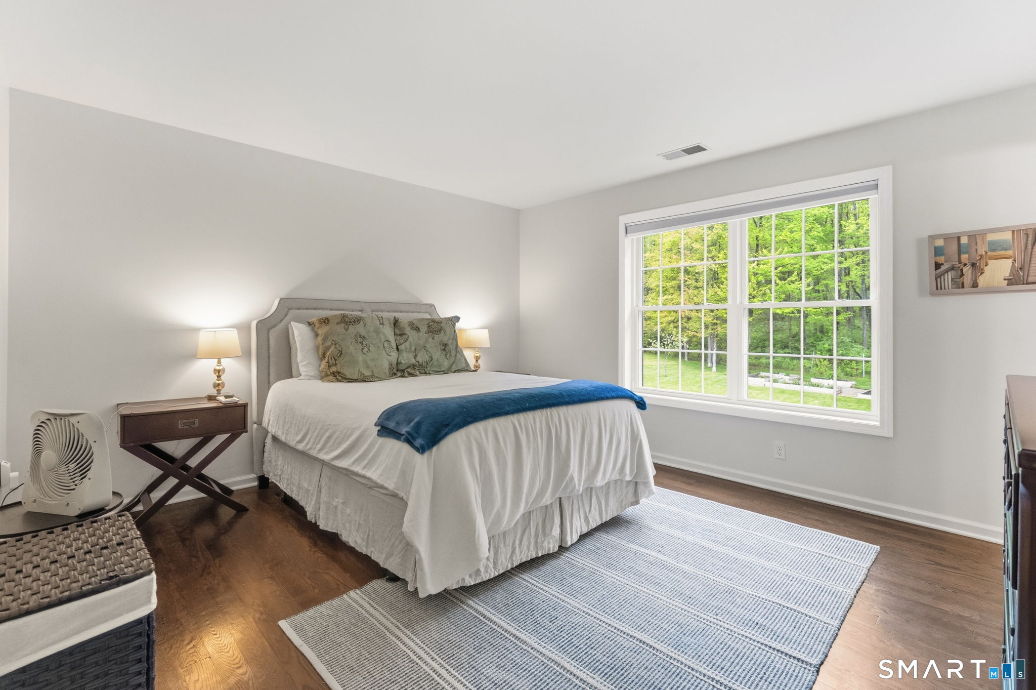 160 Canal Road Suffield, CT 06078 - Photo 20 of 40 a bedroom with a bed and wooden floor