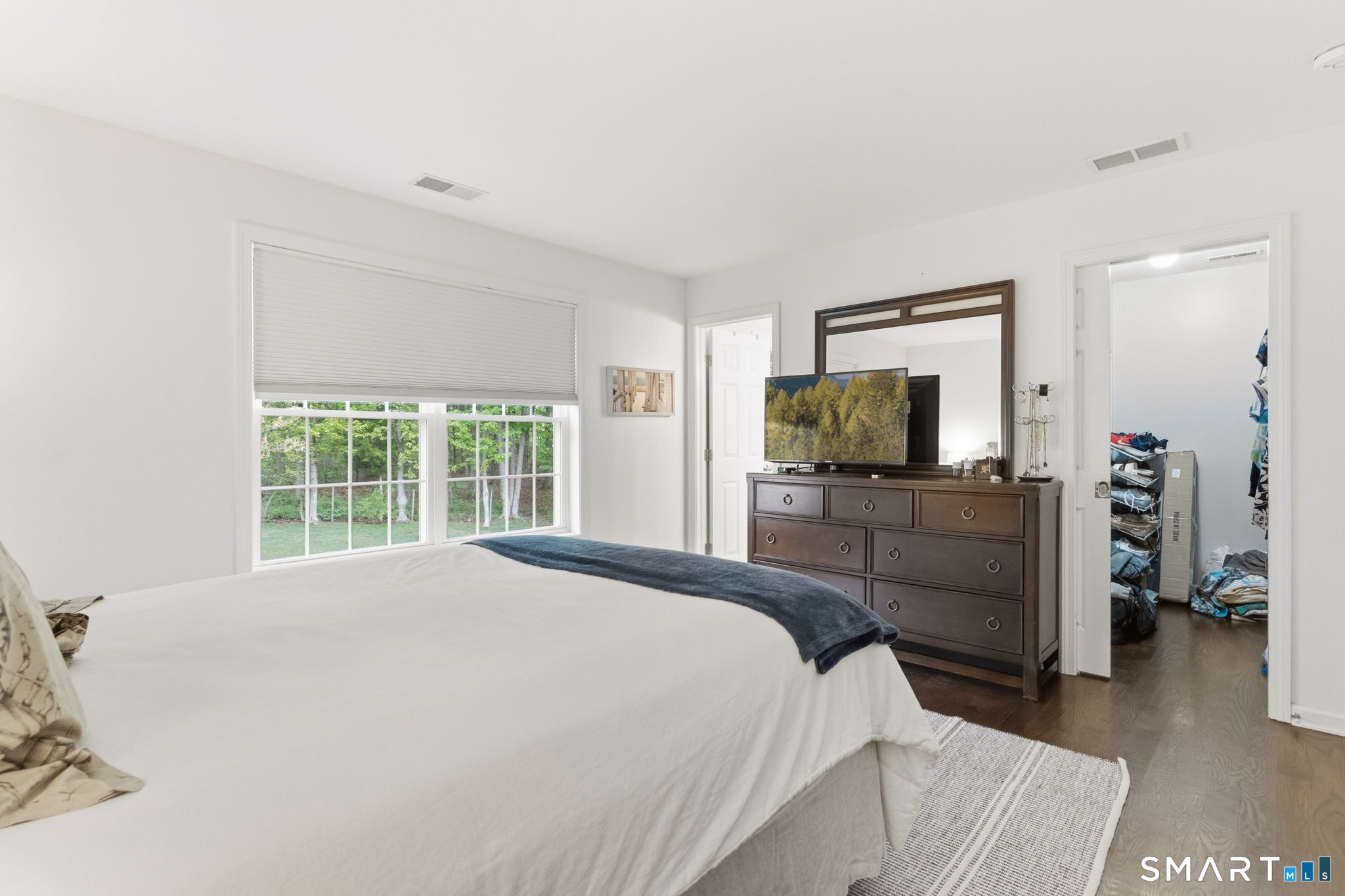 160 Canal Road Suffield, CT 06078 - Photo 21 of 40 a bedroom with a bed and a flat screen tv