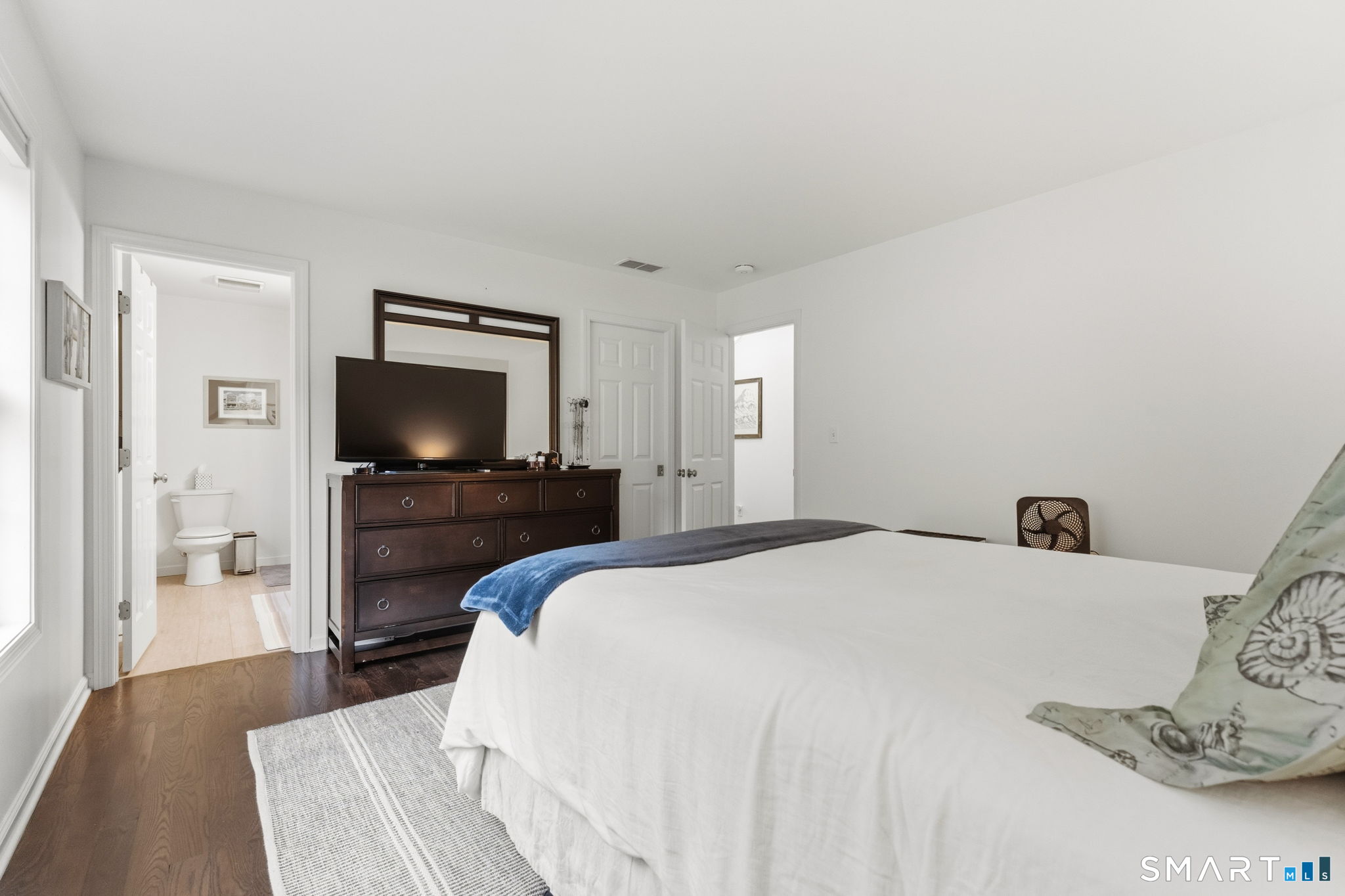 160 Canal Road Suffield, CT 06078 - Photo 22 of 40 a bedroom with a bed and a flat screen tv
