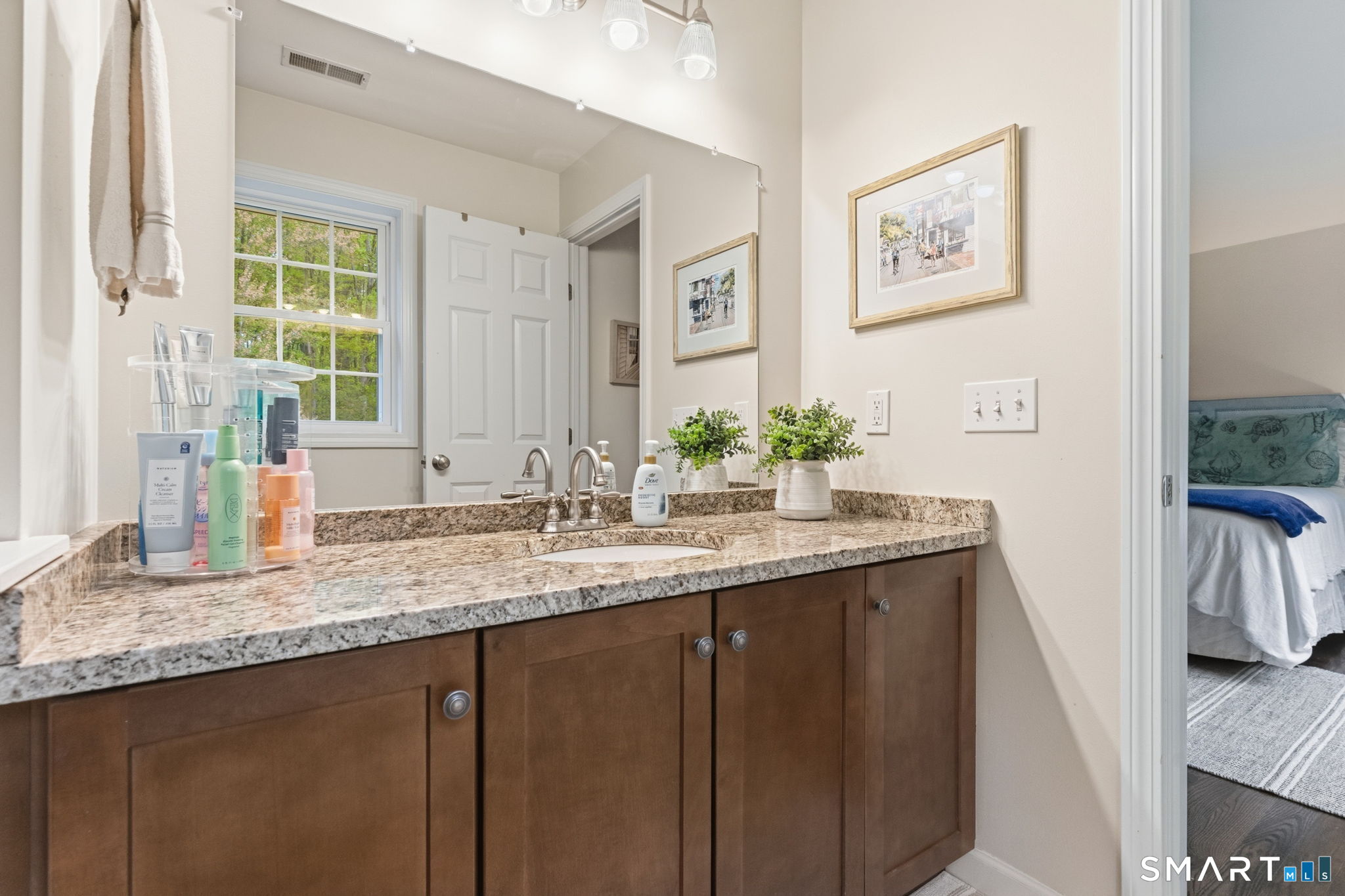 160 Canal Road Suffield, CT 06078 - Photo 24 of 40 a bathroom with a granite countertop sink and a mirror
