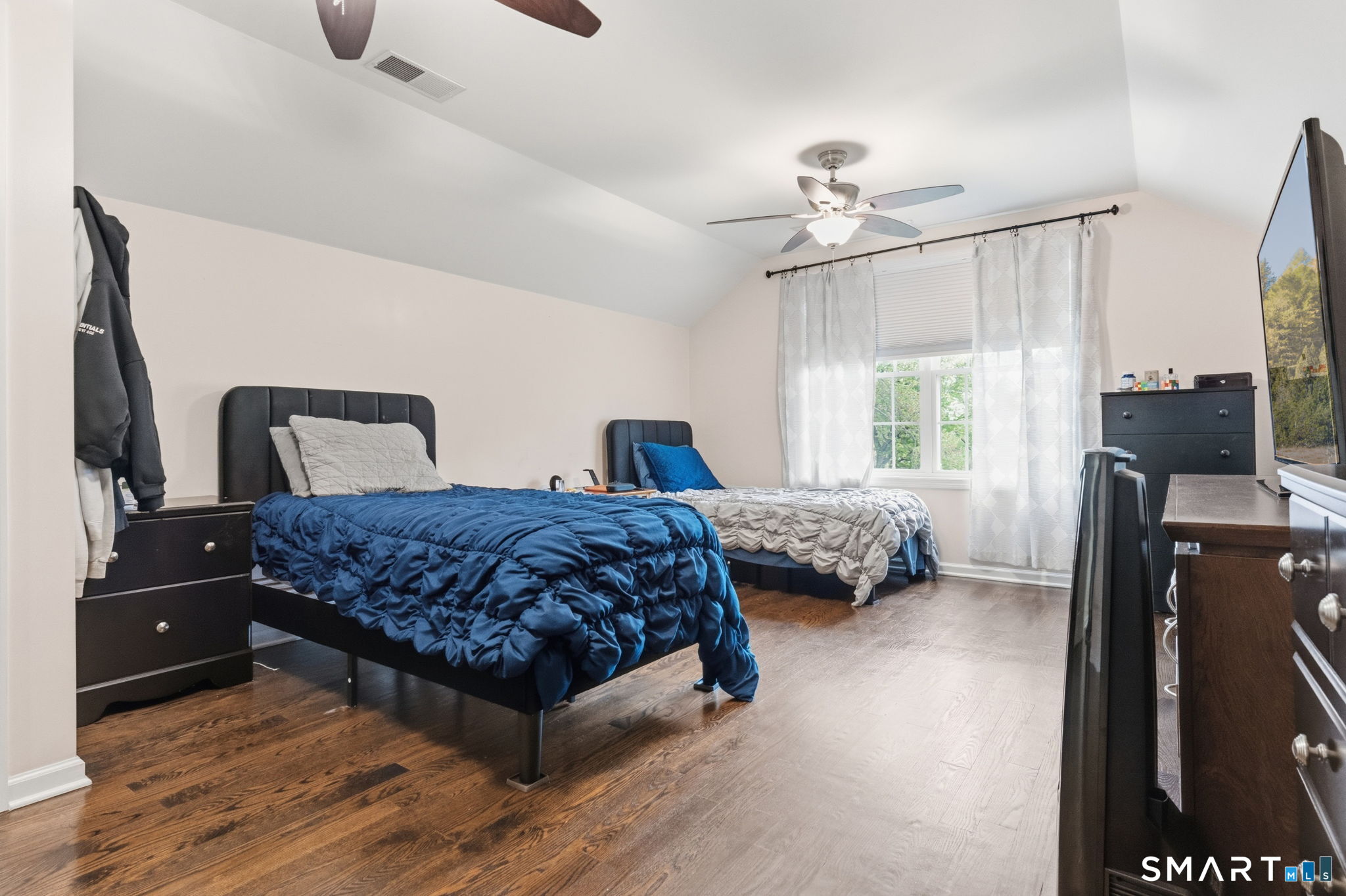 160 Canal Road Suffield, CT 06078 - Photo 25 of 40 a bedroom with a bed a window and a flat screen television