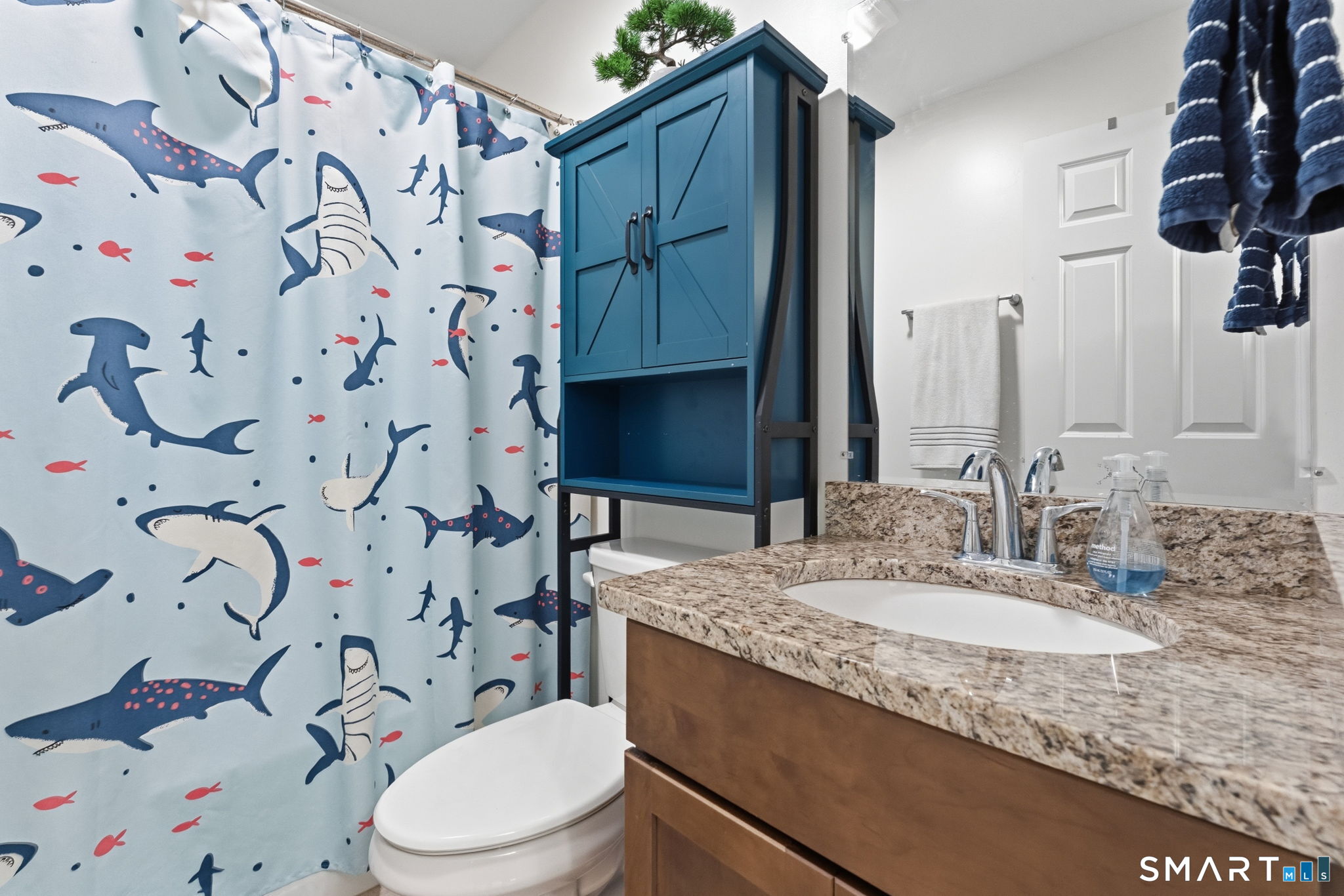 160 Canal Road Suffield, CT 06078 - Photo 27 of 40 a bathroom with a granite countertop sink and a toilet