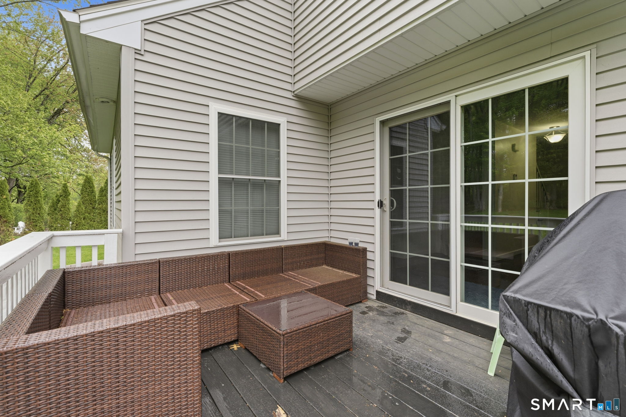160 Canal Road Suffield, CT 06078 - Photo 34 of 40 a view of a deck with a large window and wooden floor