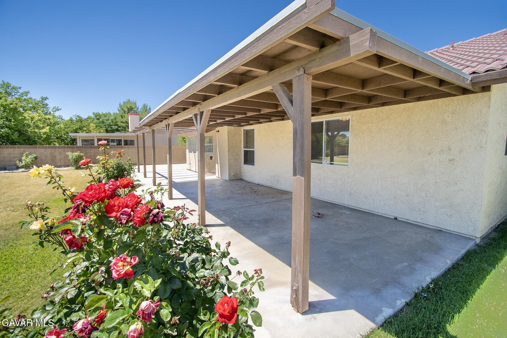44318 33rd Street West Lancaster, CA 93536 - Photo 6 of 29 a front view of house with the garden