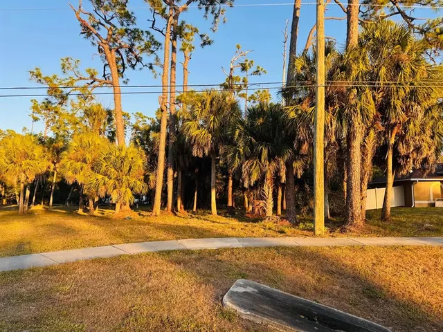 a view of swimming pool with an outdoor seating