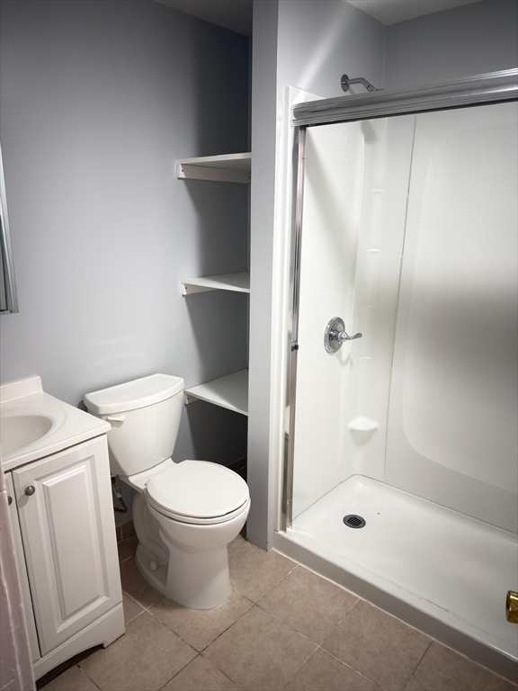 917 Main Street, Unit 2 Southbridge, MA 01550 - Photo 2 of 7 a bathroom with a shower and a toilet