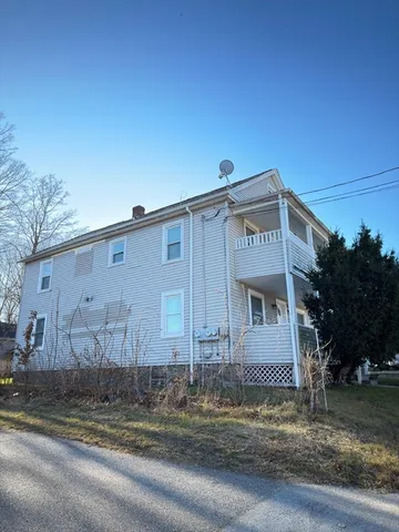 a view of a house with a street