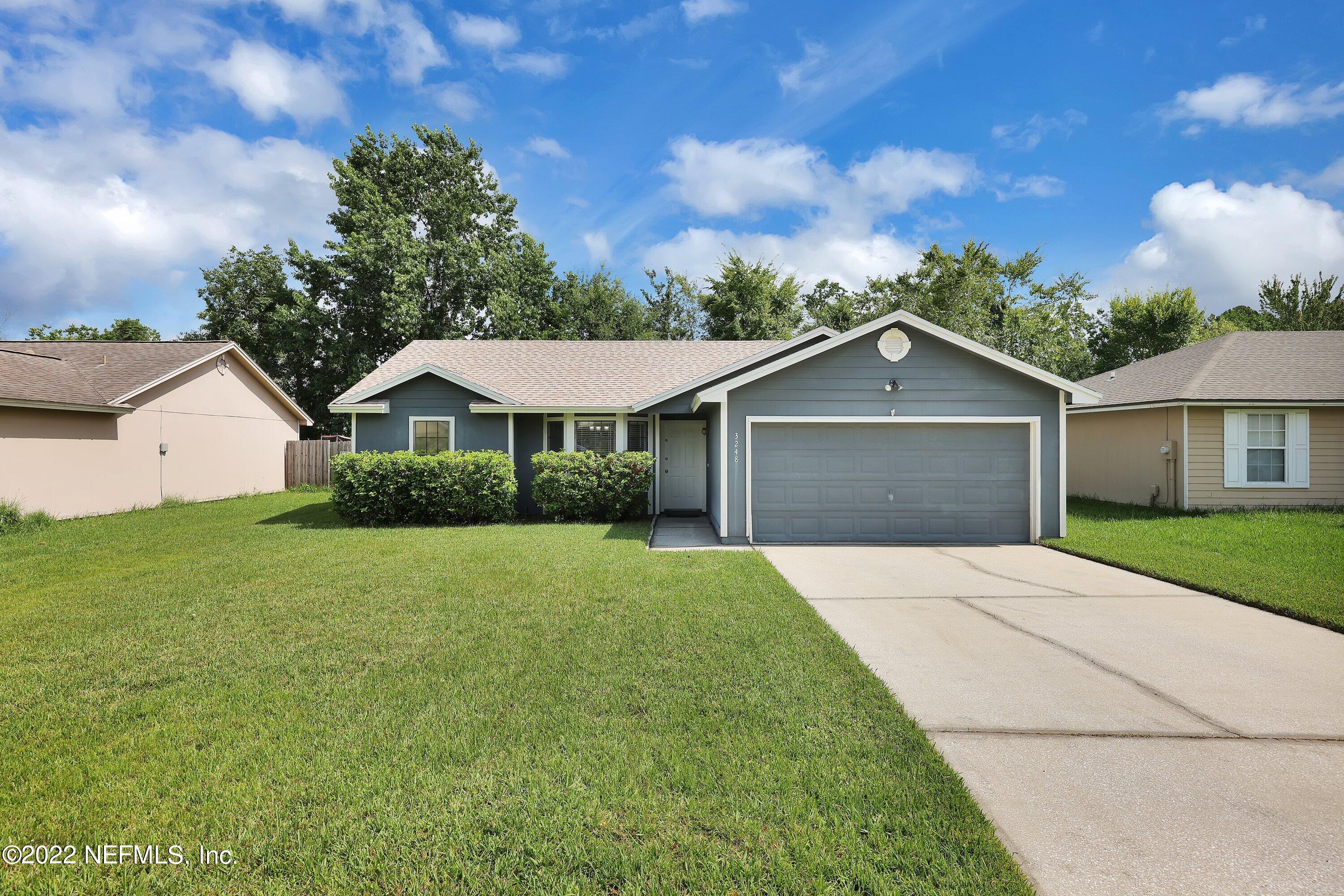3248 Dowitcher Lane Orange Park, FL 32065 - Photo 1 of 26 a front view of a house with yard