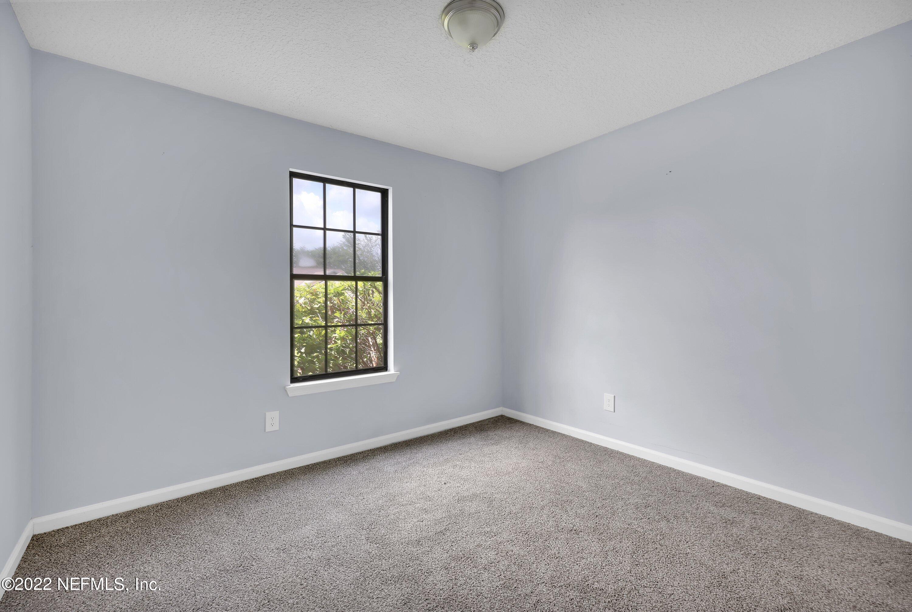 3248 Dowitcher Lane Orange Park, FL 32065 - Photo 13 of 26 a view of an empty room with a window
