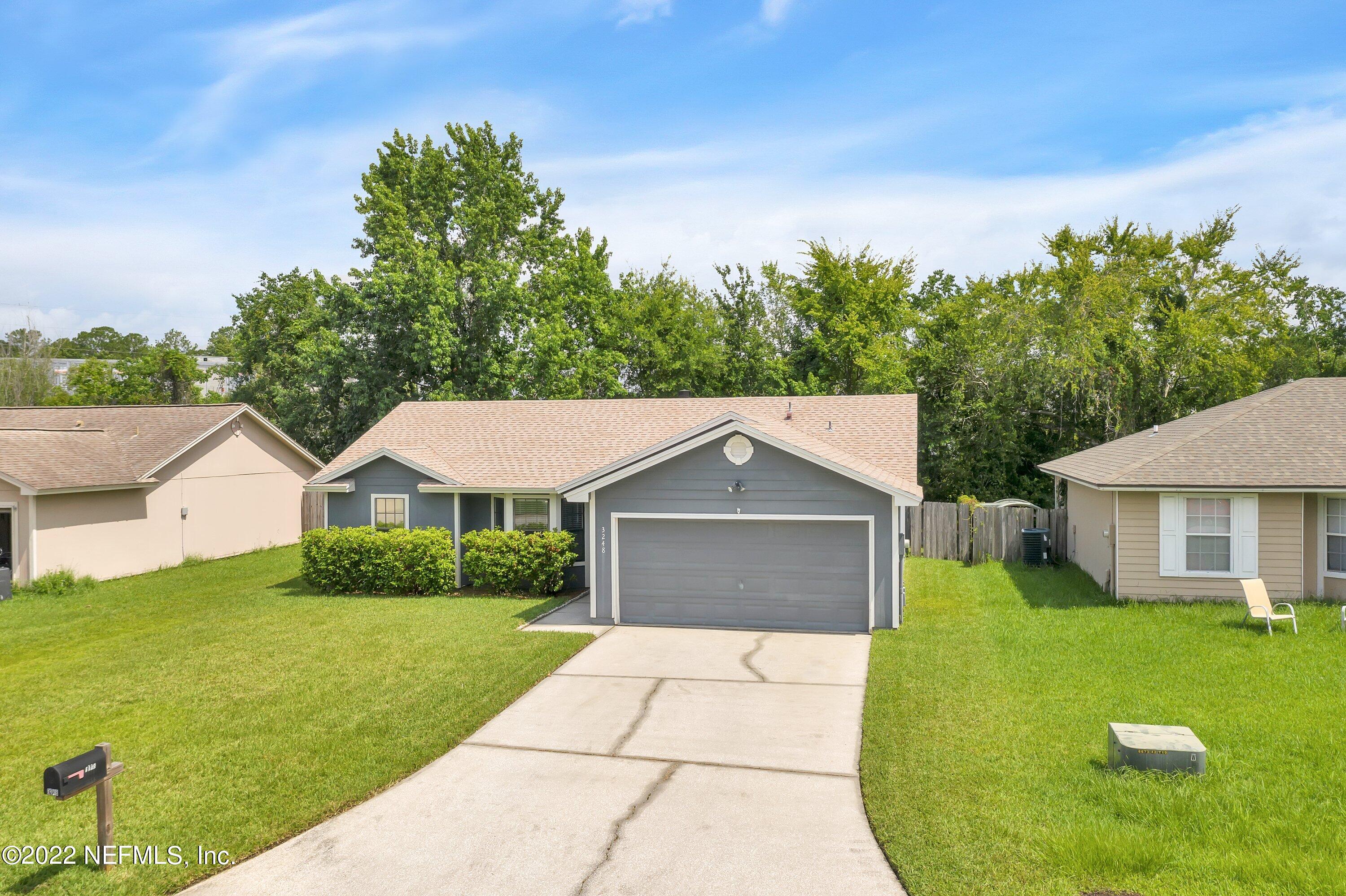 3248 Dowitcher Lane Orange Park, FL 32065 - Photo 22 of 26 a front view of a house with a yard