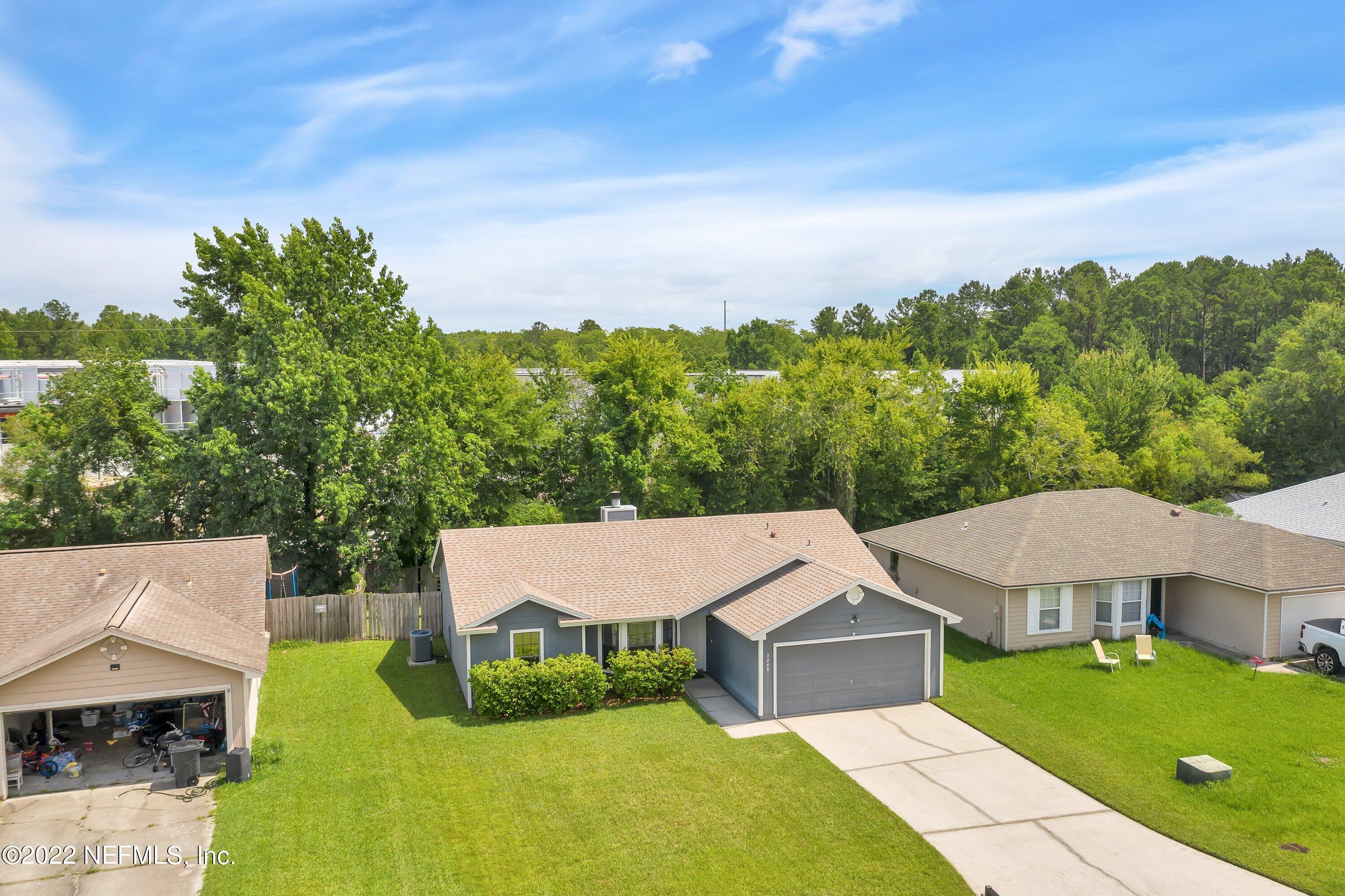 3248 Dowitcher Lane Orange Park, FL 32065 - Photo 24 of 26 an aerial view of a house with swimming pool and garden