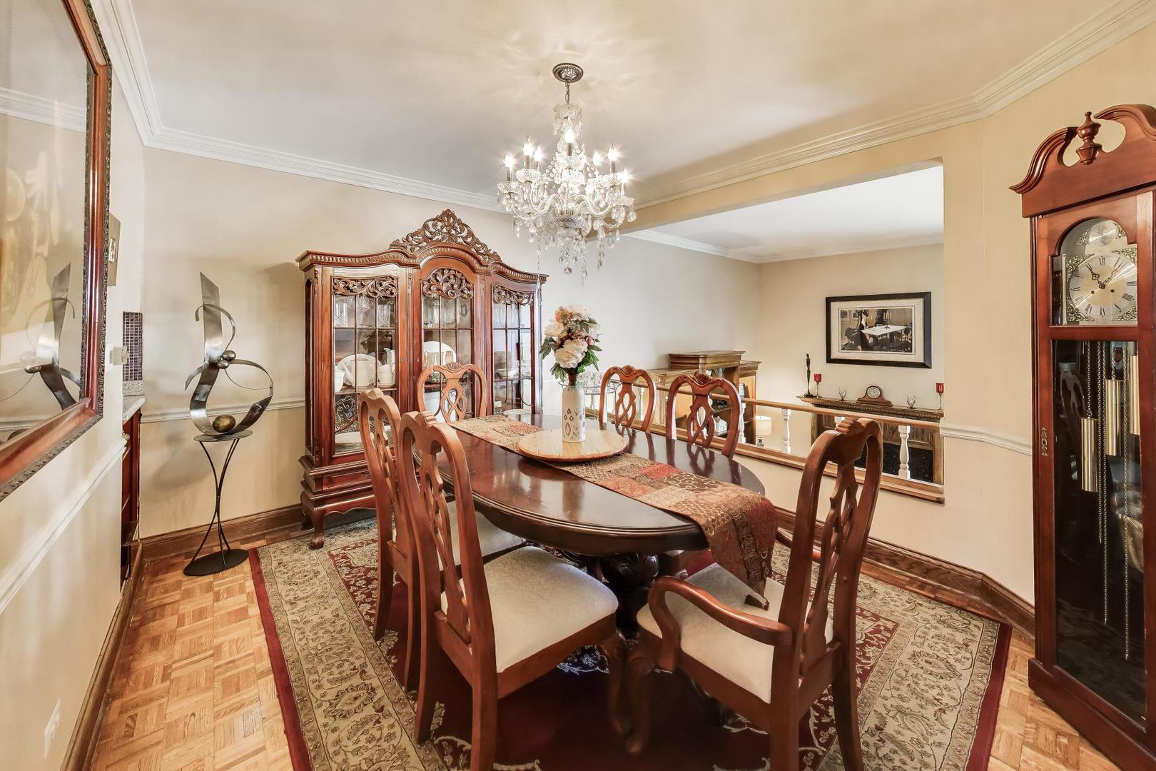 1 Maple Tree Court Elmhurst, IL 60126 - Photo 7 of 34 a view of a dining room with furniture and chandelier