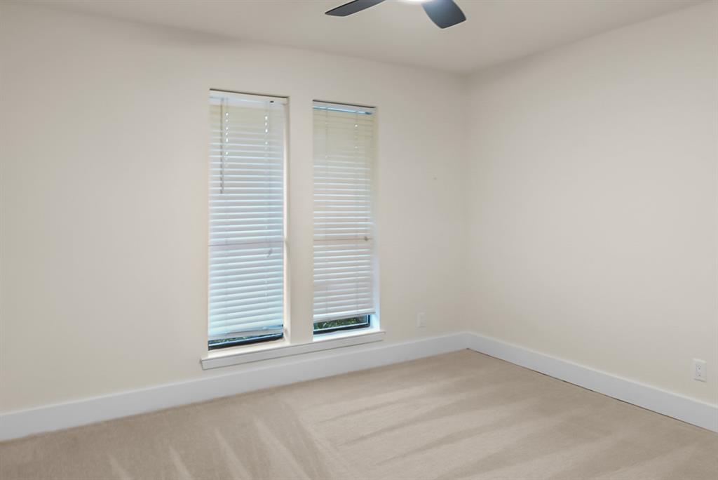 13103 Halwin Circle Dallas, TX 75243 - Photo 12 of 15 Empty room featuring light colored carpet and a ceiling fan