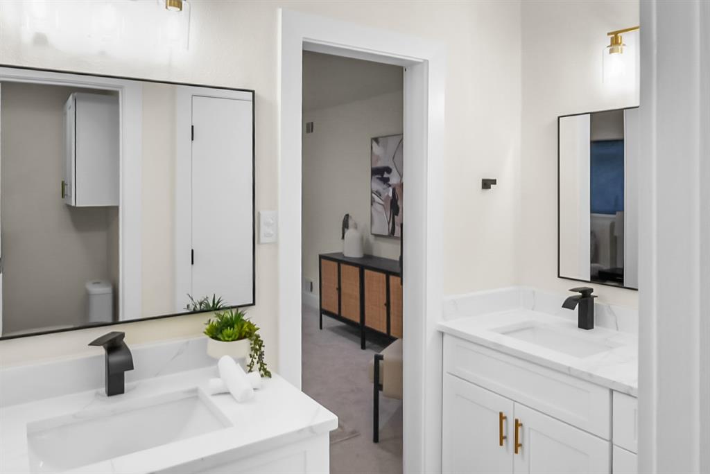 13103 Halwin Circle Dallas, TX 75243 - Photo 10 of 15 Full bath featuring two vanities and light colored carpet