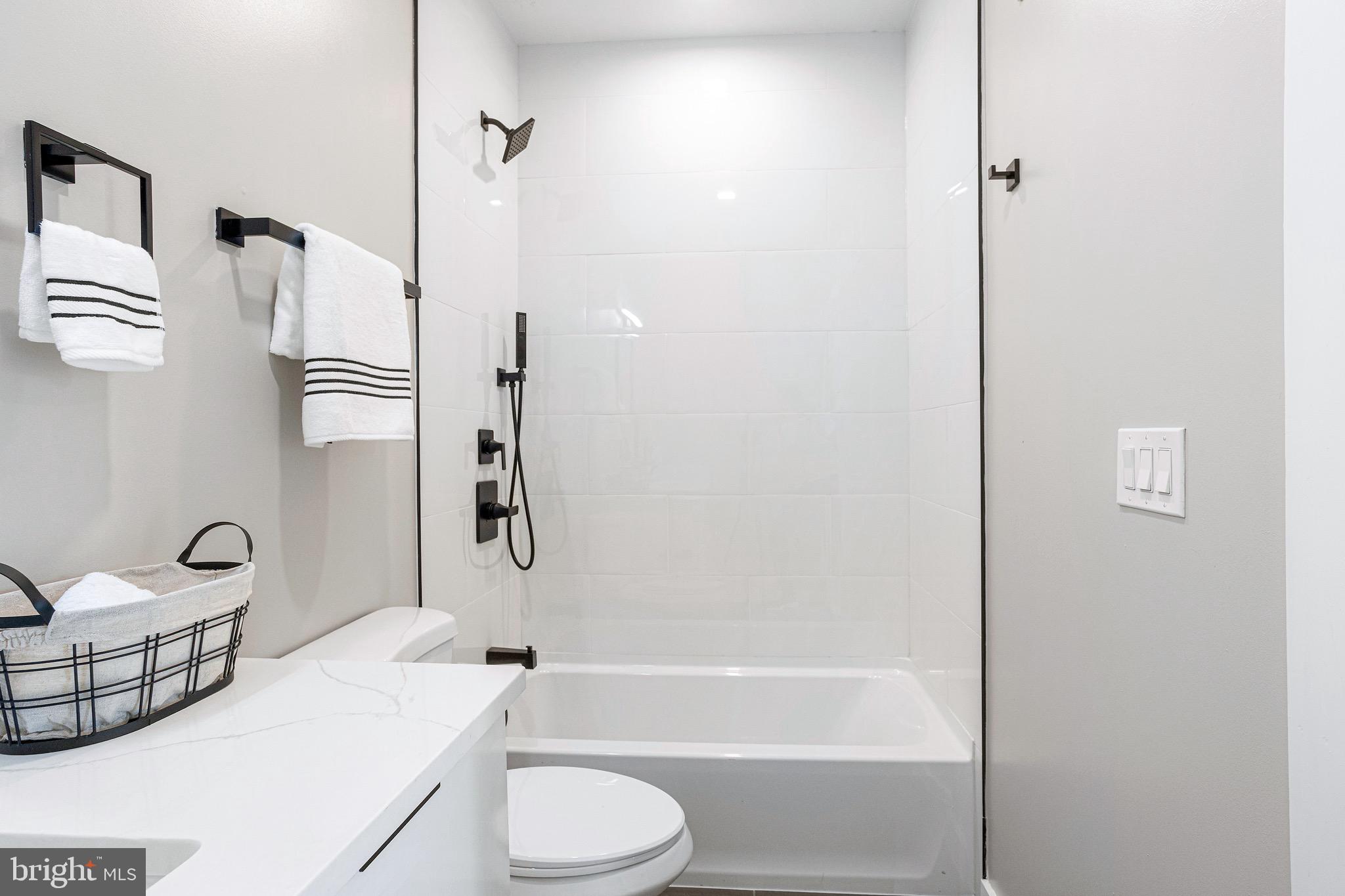 1358 Florida Avenue Northeast, Unit 401 Washington, DC 20002 - Photo 8 of 12 a bathroom with a bathtub and shower